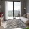 Large, well-lit living space with balcony entrance
