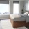 Penthouse primary bedroom with handsome views