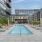 Sparkling pool with cabana and sun loungers